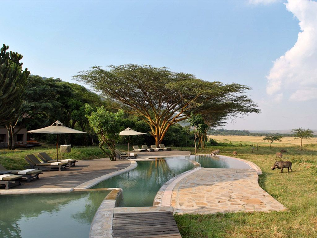 Cette image peut contenir Pavé, Resort, Hôtel, Édifice, Extérieur, Piscine, Eau, Mobilier et Banc